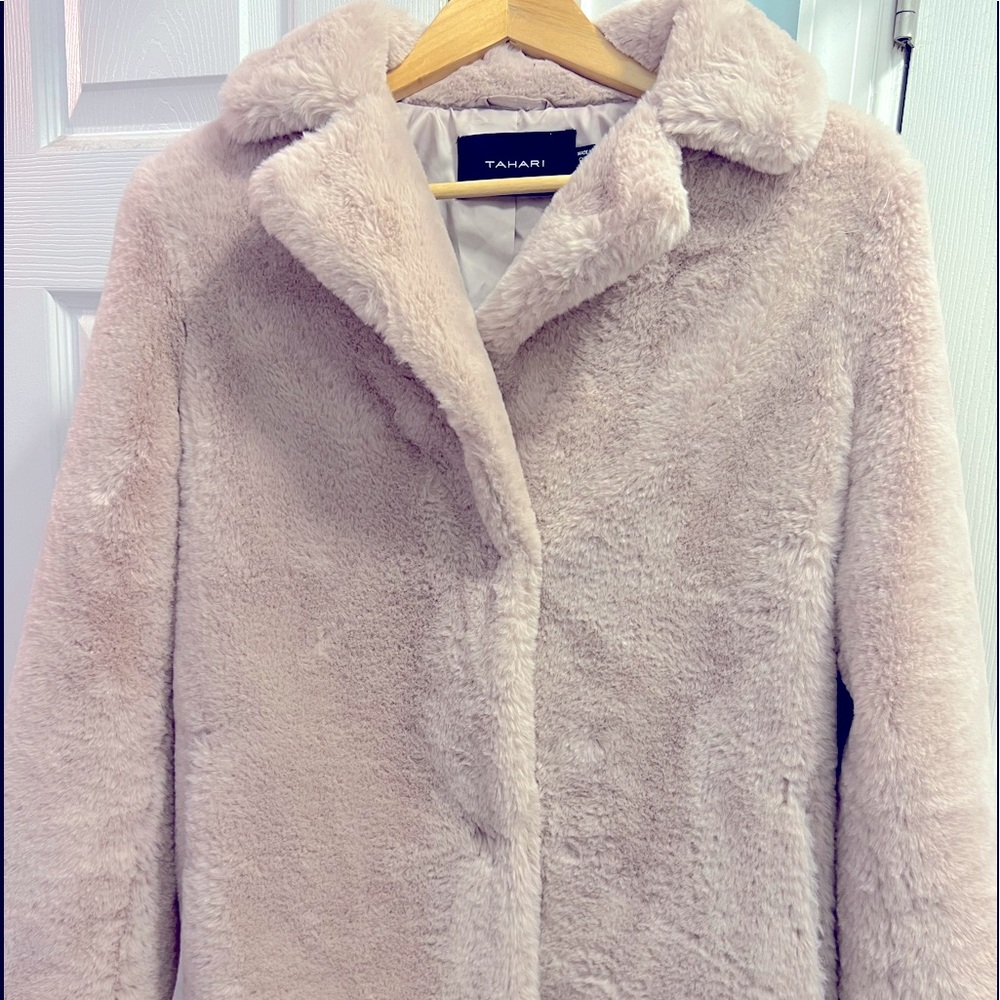 Very fuzzy jacket. Super warm and fun to wear! Pale pink.